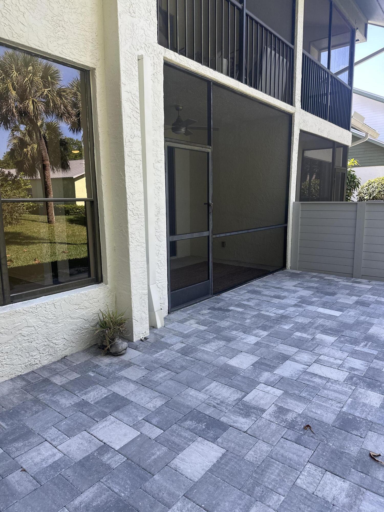 5270 Southeast Seascape Way, Unit 102 Stuart, FL 34997 - Photo 18 of 24 Backyard patio