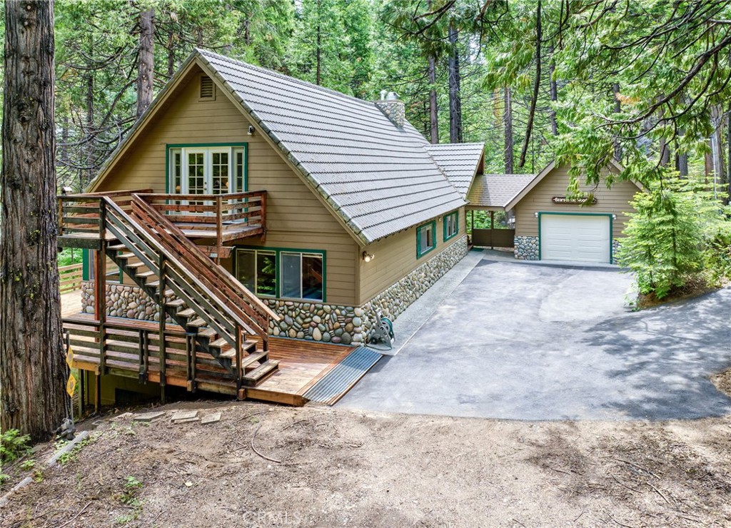 7663 Forest Drive Fish Camp, CA 93623 - Photo 2 of 43 a view of front of a house with a yard
