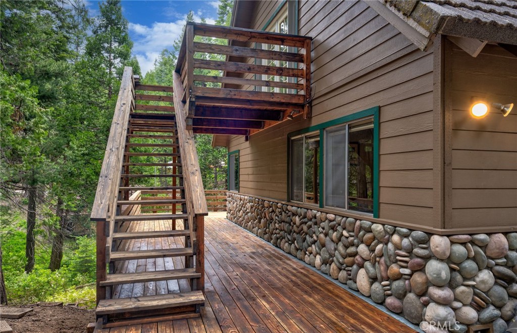 7663 Forest Drive Fish Camp, CA 93623 - Photo 25 of 43 a view of a house with backyard and deck