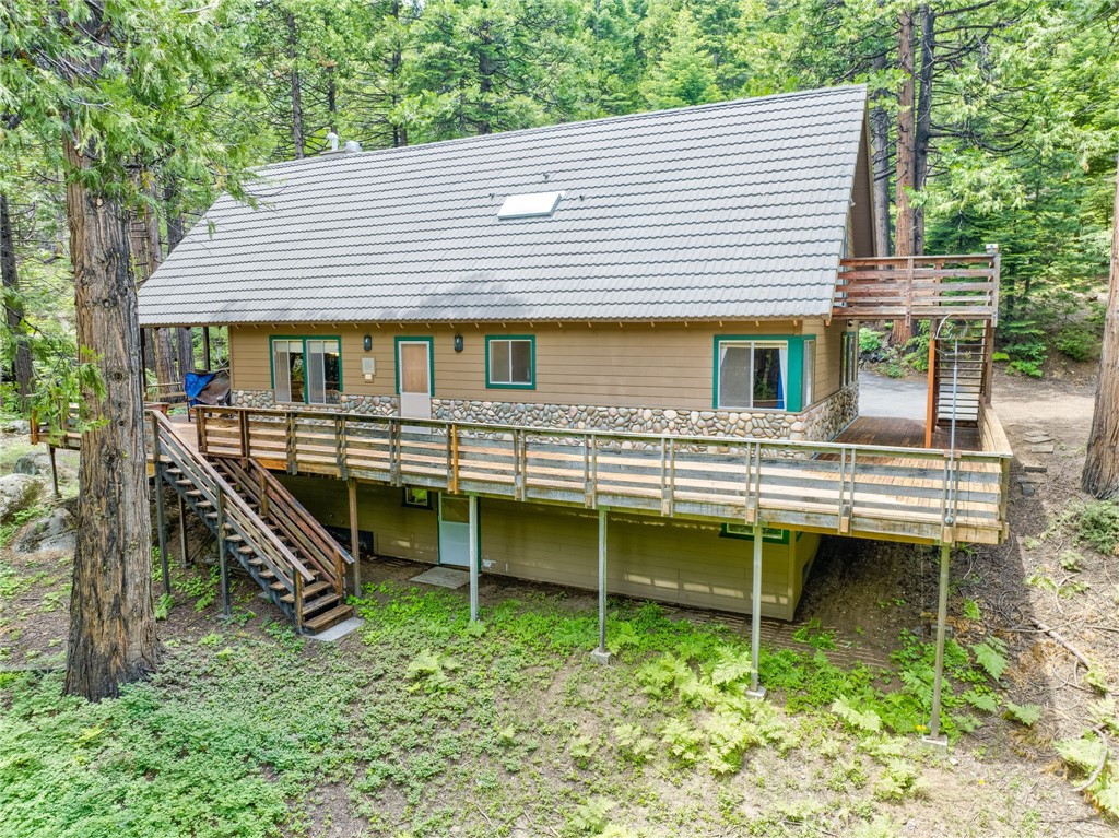 7663 Forest Drive Fish Camp, CA 93623 - Photo 28 of 43 a view of a house with a balcony and deck