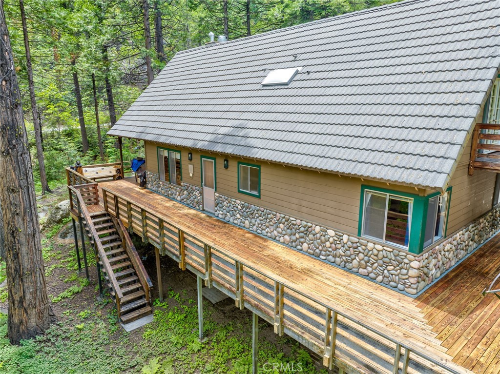 7663 Forest Drive Fish Camp, CA 93623 - Photo 29 of 43 a front view of a house with balcony