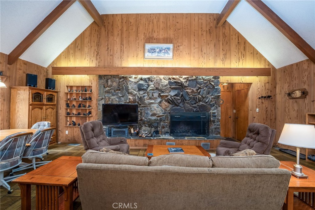 7663 Forest Drive Fish Camp, CA 93623 - Photo 5 of 43 a living room with furniture and a flat screen tv