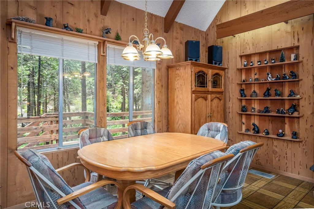 7663 Forest Drive Fish Camp, CA 93623 - Photo 7 of 43 a view of a dining room with furniture window and outside view
