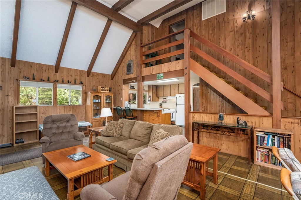 7663 Forest Drive Fish Camp, CA 93623 - Photo 8 of 43 a living room with furniture a rug and white walls