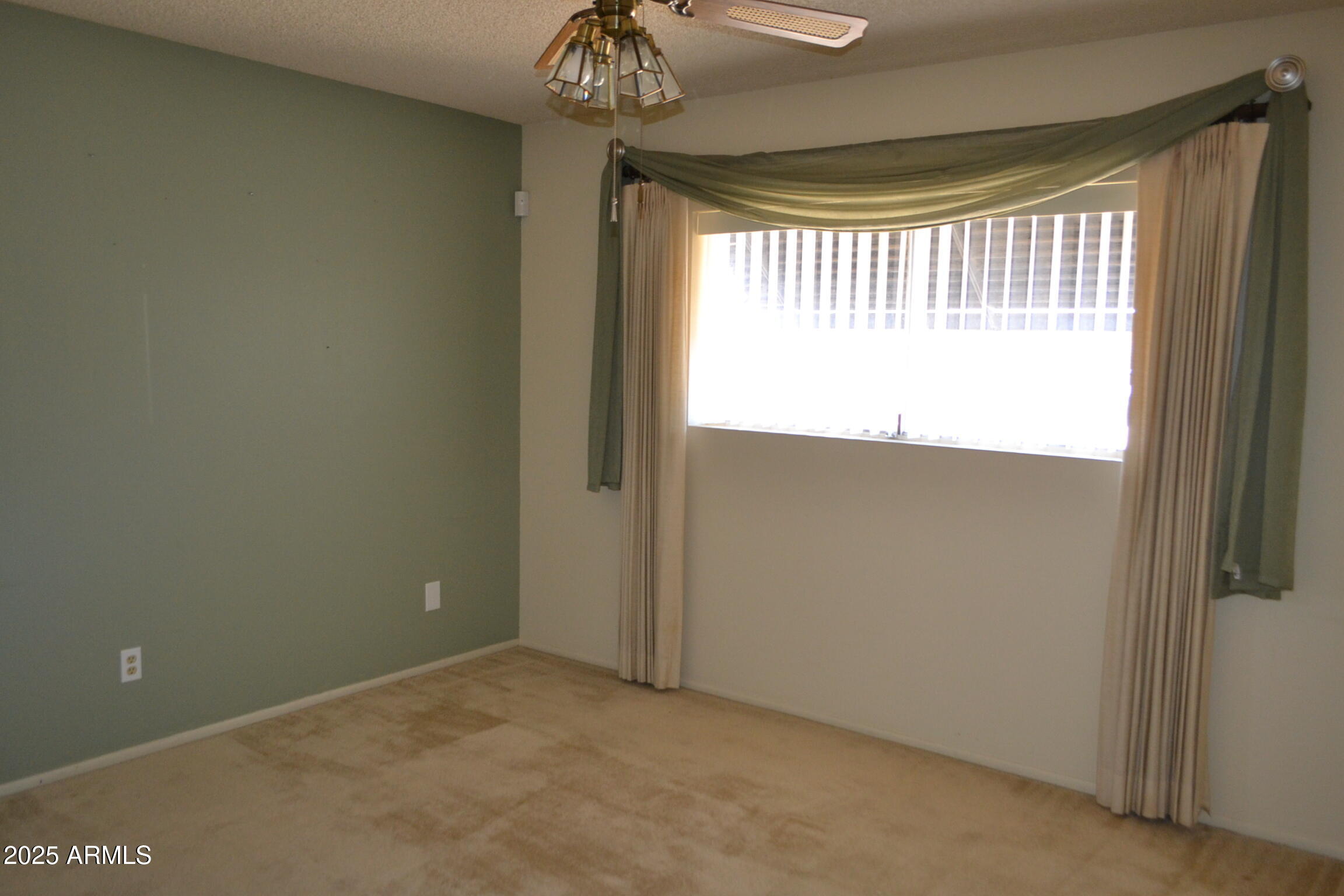 1710 West 13th Avenue Apache Junction, AZ 85120 - Photo 16 of 24 a view of an empty room and a window