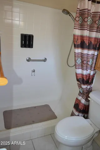 a bathroom with a toilet and a sink