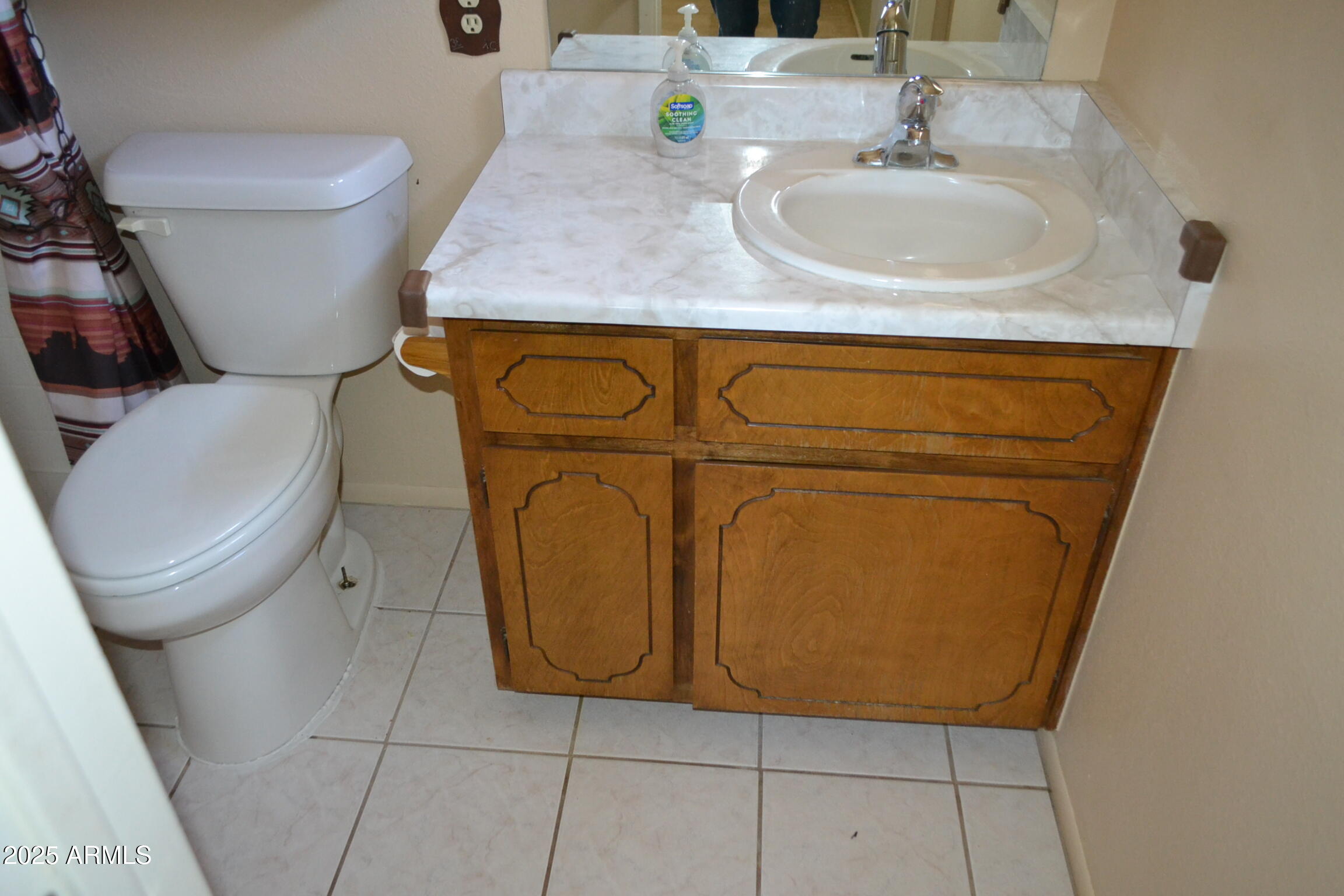 1710 West 13th Avenue Apache Junction, AZ 85120 - Photo 19 of 24 a bathroom with a toilet and a sink