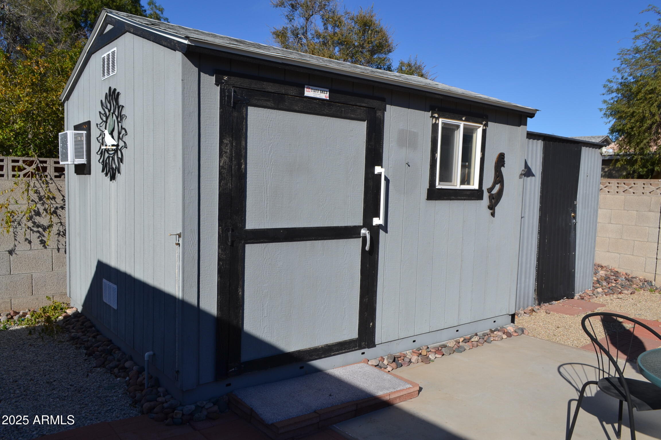 1710 West 13th Avenue Apache Junction, AZ 85120 - Photo 23 of 24 a front view of a house with garden
