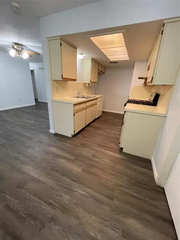 a view of kitchen and wooden floor