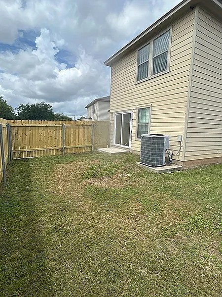 5211 Viewpoint Drive Austin, TX 78744 - Photo 22 of 25 a view of a house with a backyard