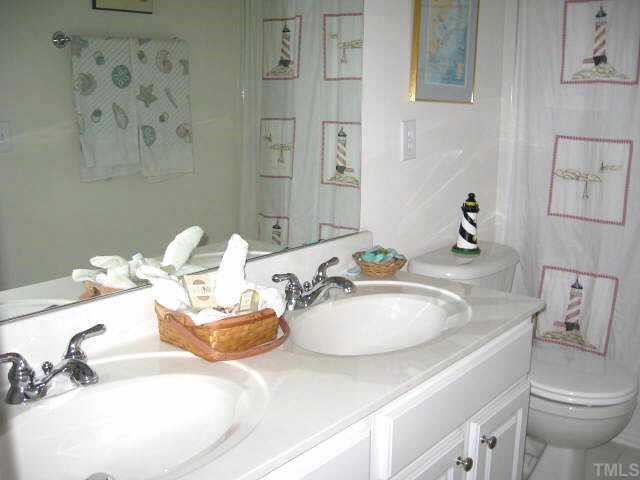 7710 Elon Drive Raleigh, NC 27613 - Photo 10 of 12 Convenient full bath with dual vanity areas & tile floor Other