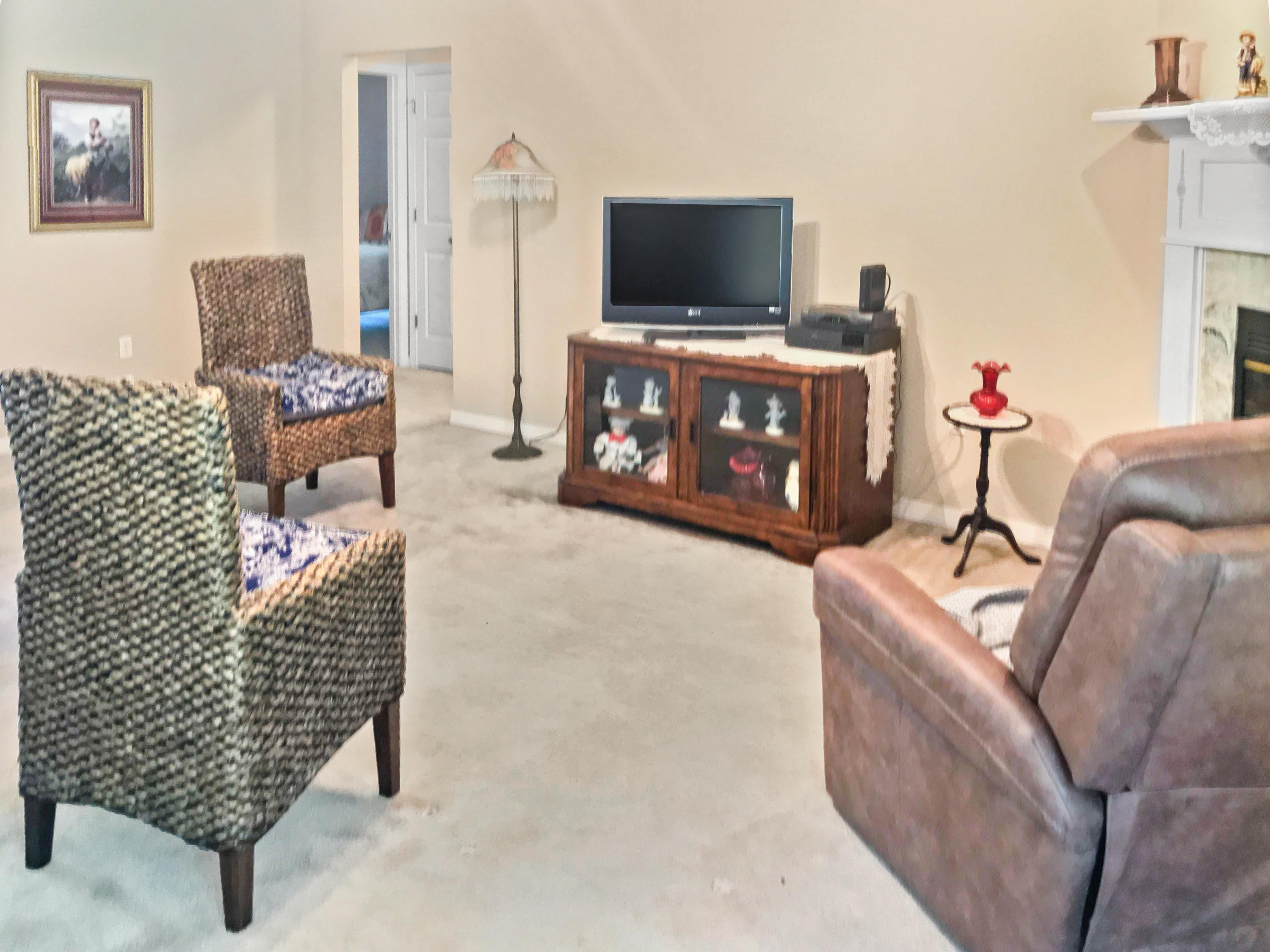 4441 Antioch Road Crestview, FL 32536 - Photo 12 of 14 a living room with furniture and a flat screen tv