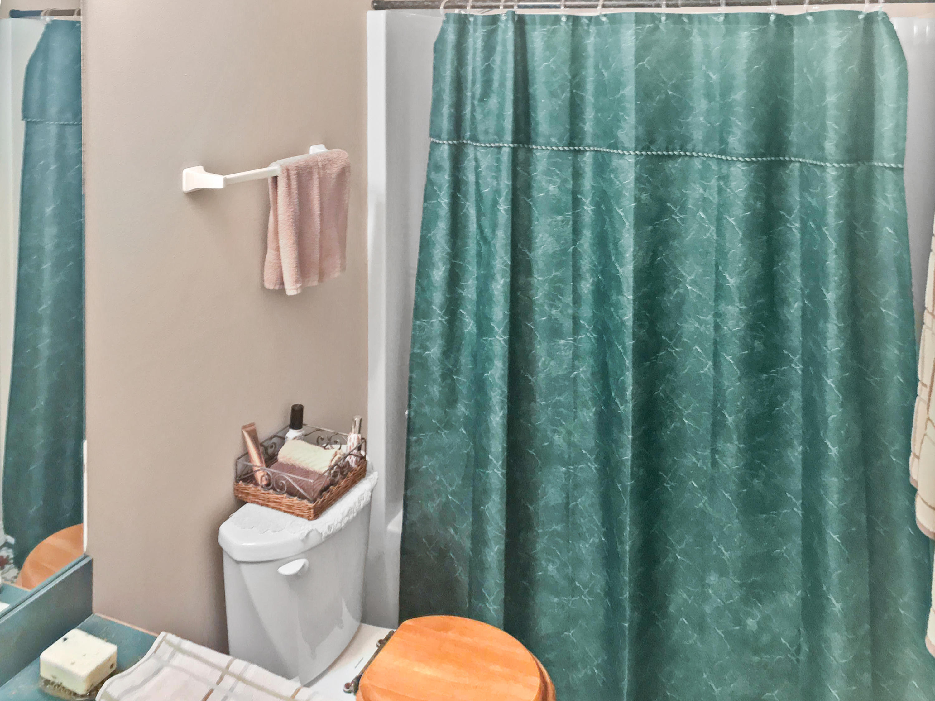 4441 Antioch Road Crestview, FL 32536 - Photo 6 of 14 a white toilet sitting next to a bathroom sink