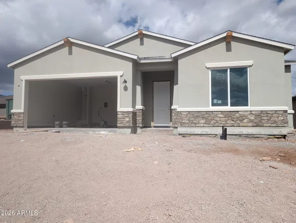 a front view of a house with a garage