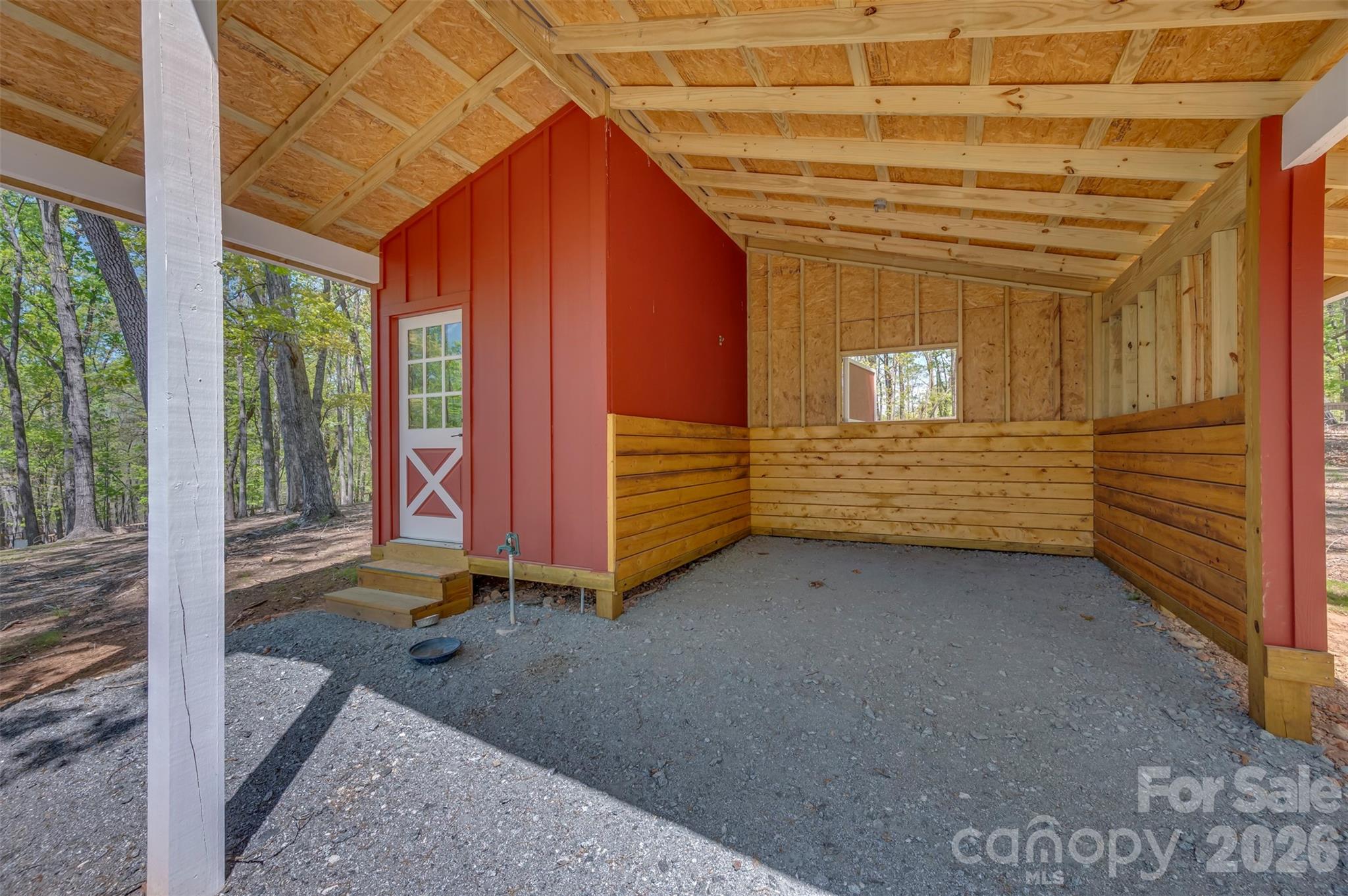 2825 River Road Columbus, NC 28722 - Photo 32 of 46 a view of a room with wooden walls and stairs