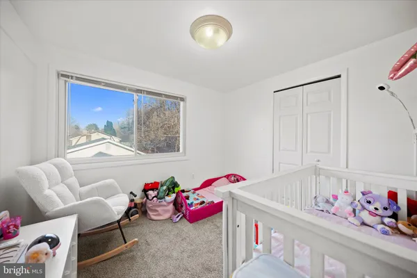 a bedroom with furniture and a chandelier