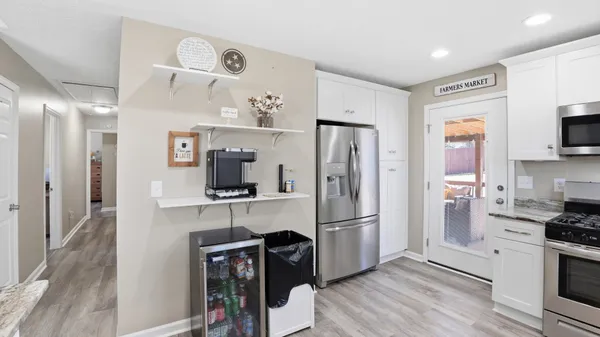 a bathroom with a sink vanity and a mirror