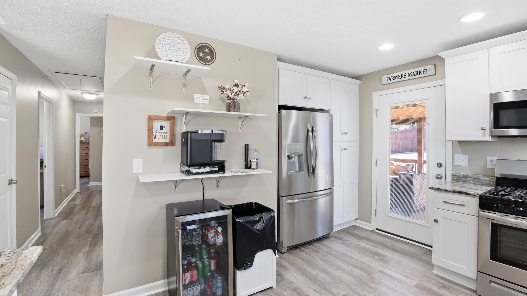 32 McGee Road McMinnville, TN 37110 - Photo 15 of 56 a kitchen with stainless steel appliances a refrigerator cabinets and wooden floor