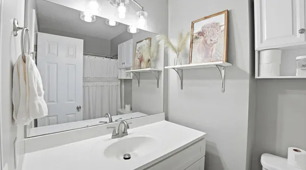 a view of a livingroom with workspace and a window