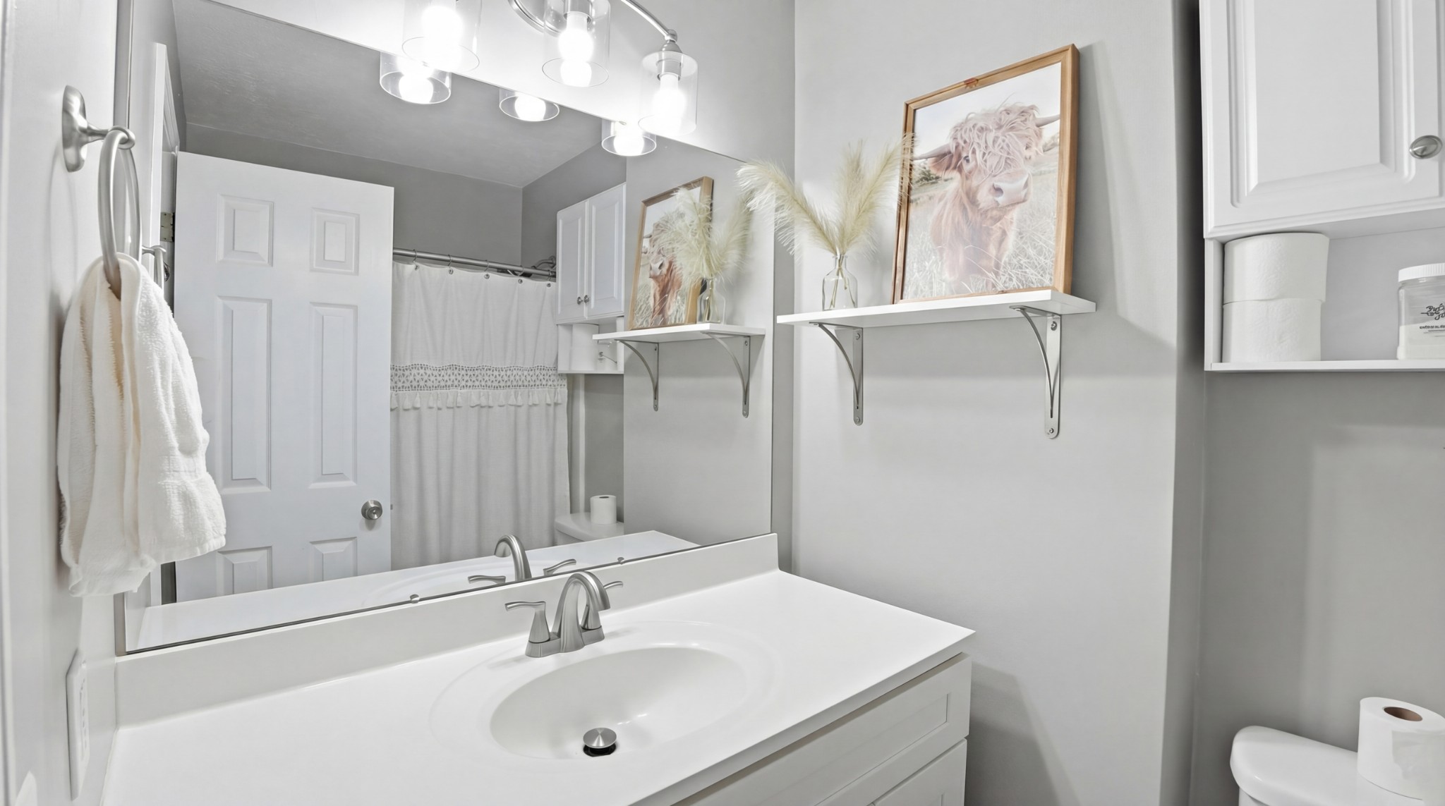 32 McGee Road McMinnville, TN 37110 - Photo 16 of 56 a bathroom with a sink vanity and a mirror