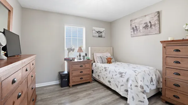 a bedroom with a bed and a window in it