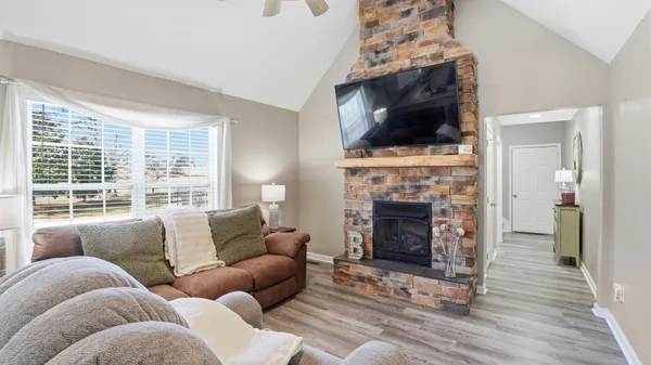 a kitchen with stainless steel appliances granite countertop a stove refrigerator sink and cabinets