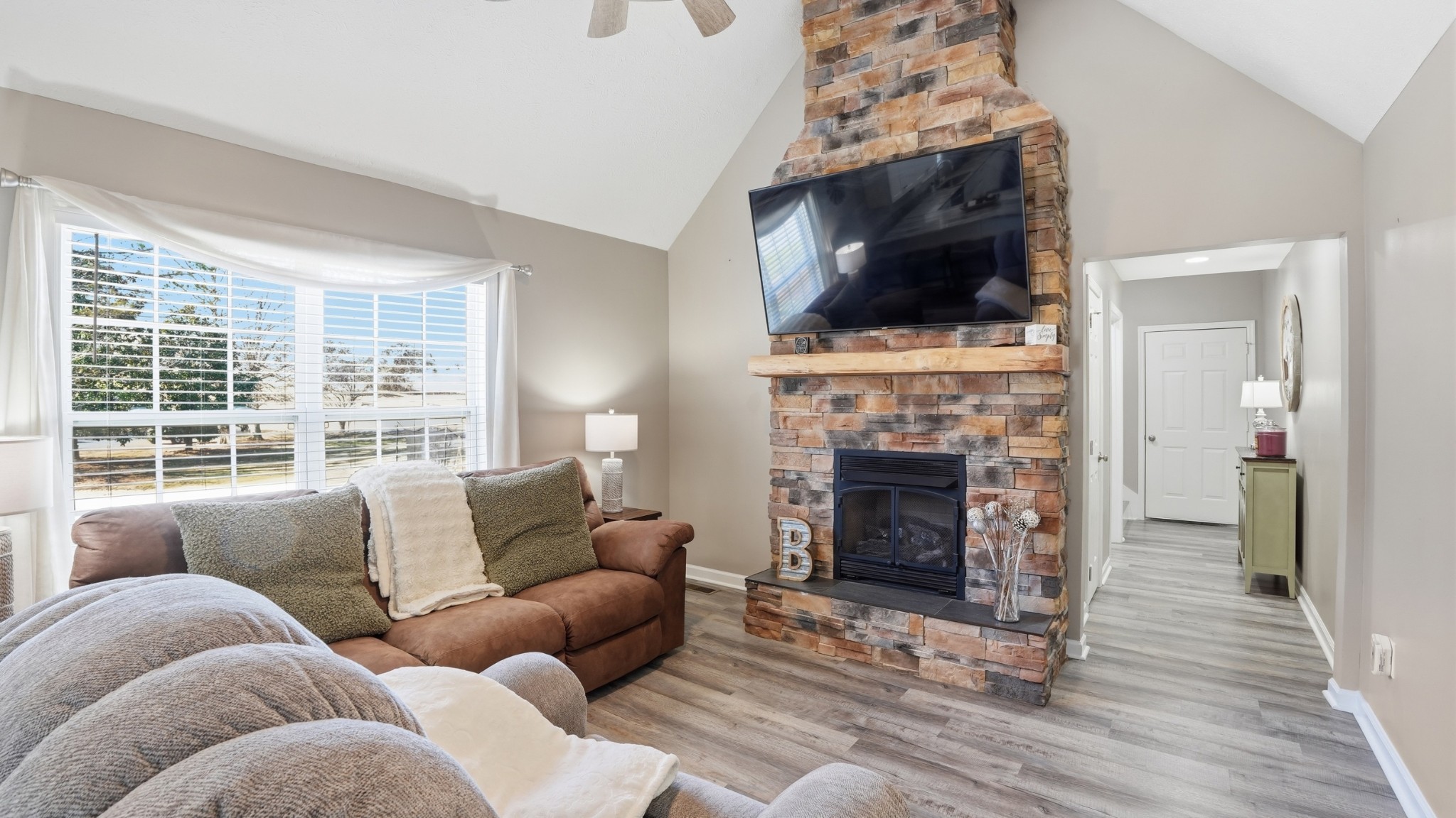 32 McGee Road McMinnville, TN 37110 - Photo 10 of 56 a living room with furniture a flat screen tv and a fireplace