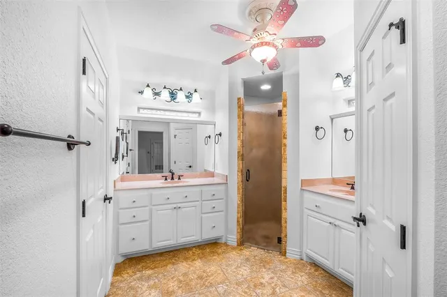 a bathroom with a sink a vanity and a mirror