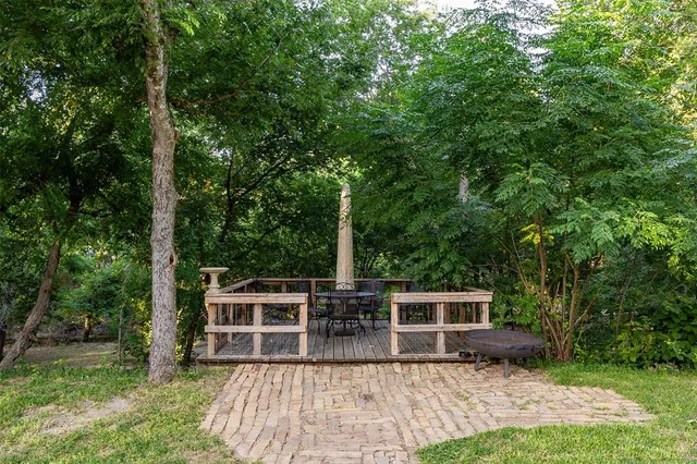 a view of a house with backyard porch and sitting area