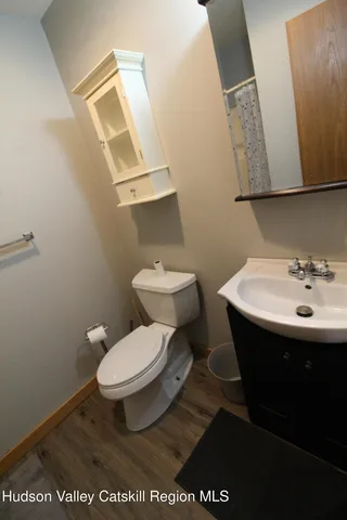 a white toilet sitting next to a bathroom sink