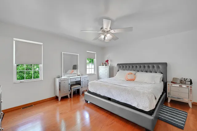 a bedroom with a bed furniture and a window