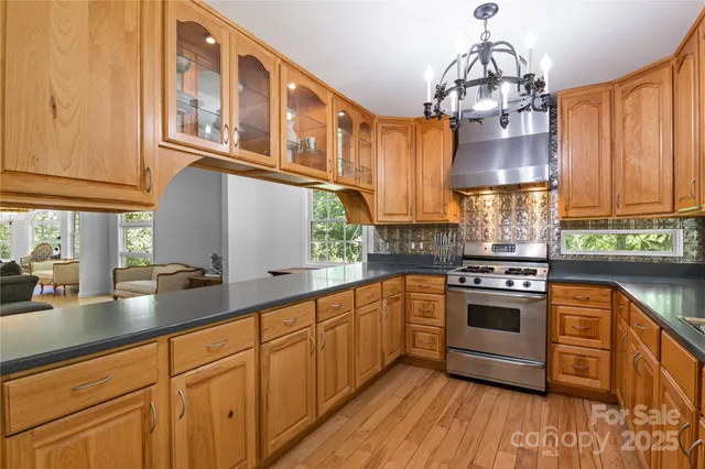 a stove top oven sitting inside of a kitchen