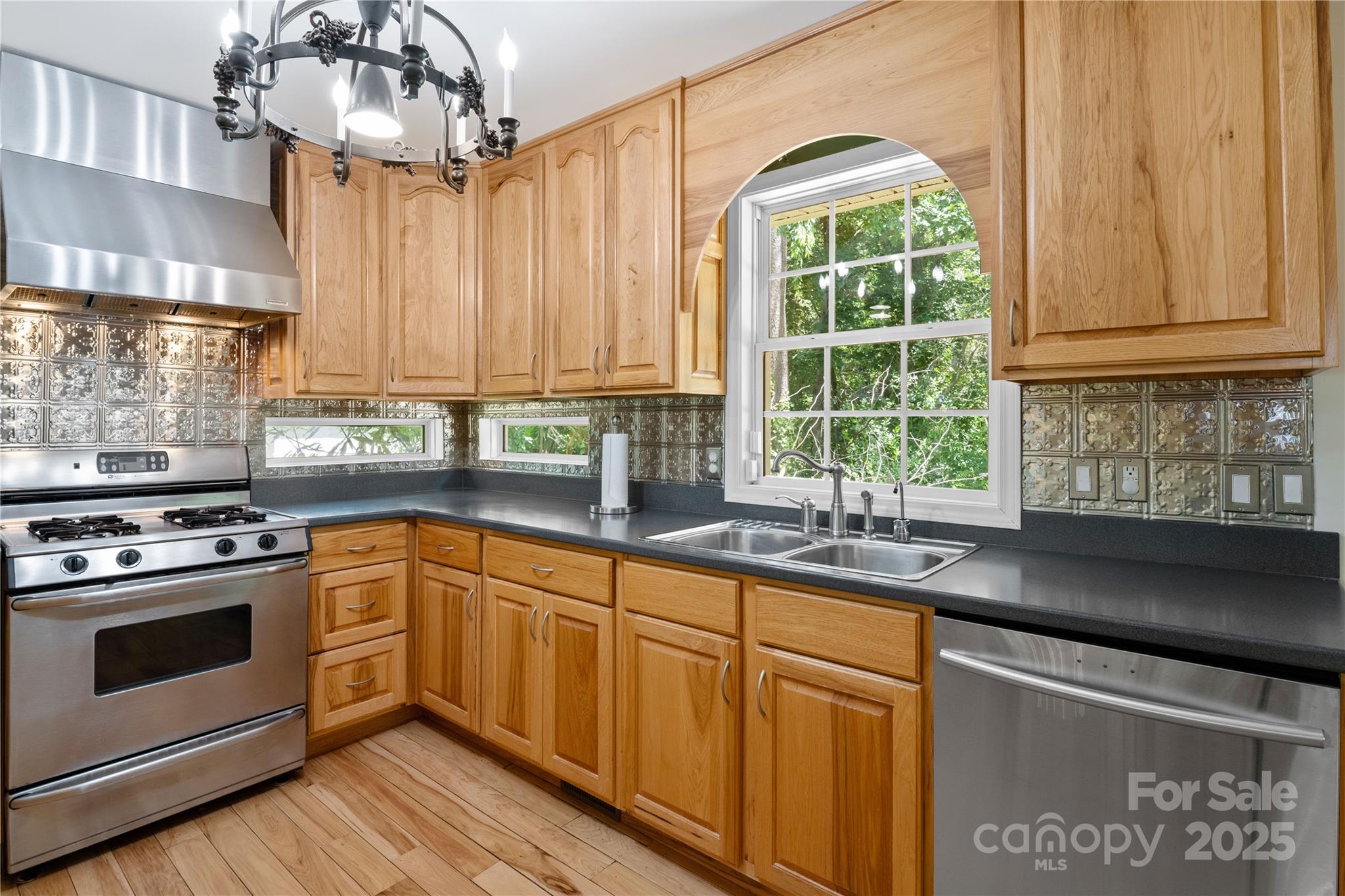 3 Northwood Road Asheville, NC 28804 - Photo 17 of 48 a kitchen with stainless steel appliances granite countertop a sink a stove and a microwave