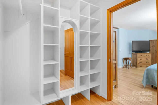 a bathroom with a sink mirror and window