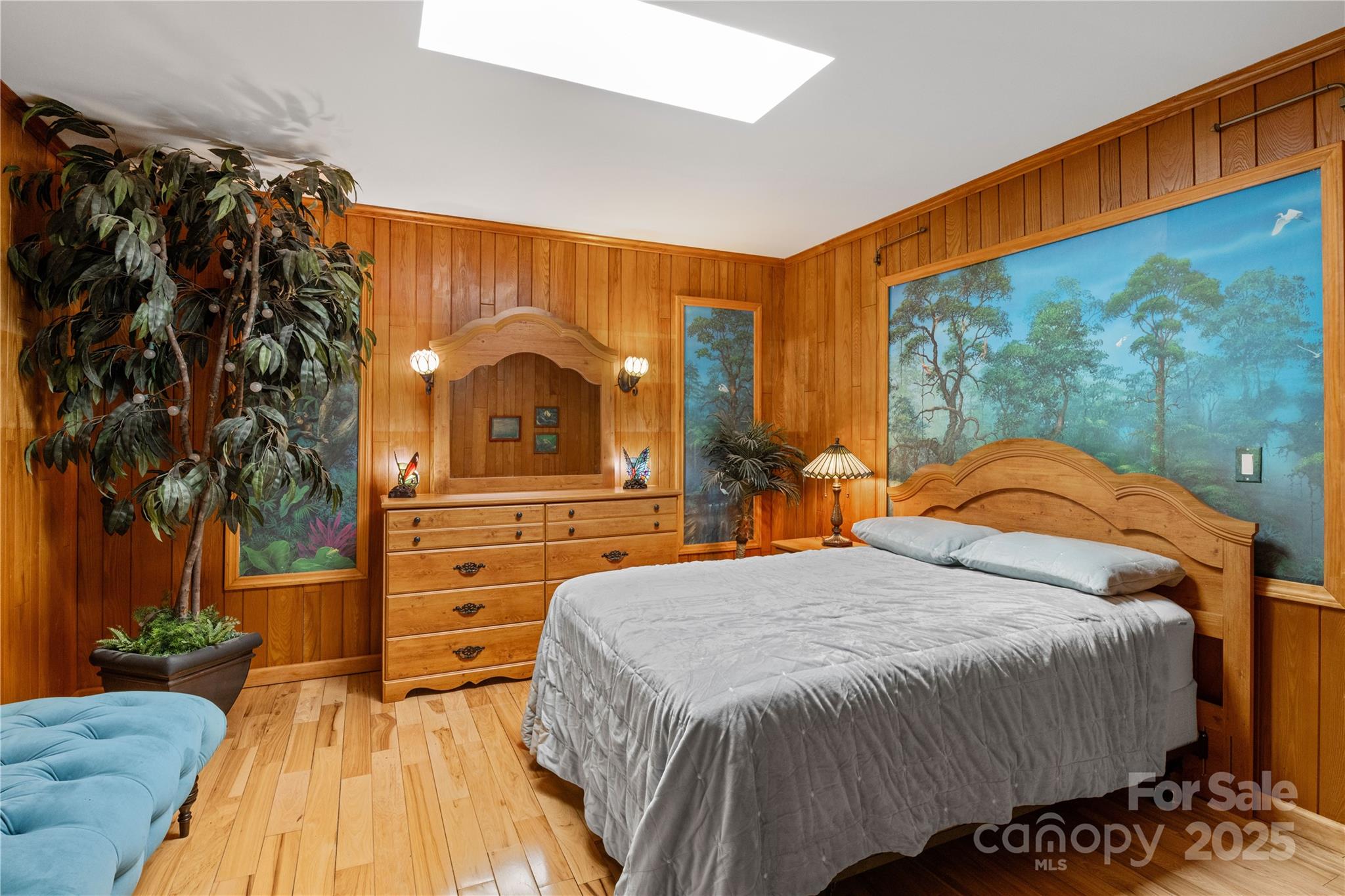 3 Northwood Road Asheville, NC 28804 - Photo 25 of 48 a bedroom with a bed and a painting on the wall
