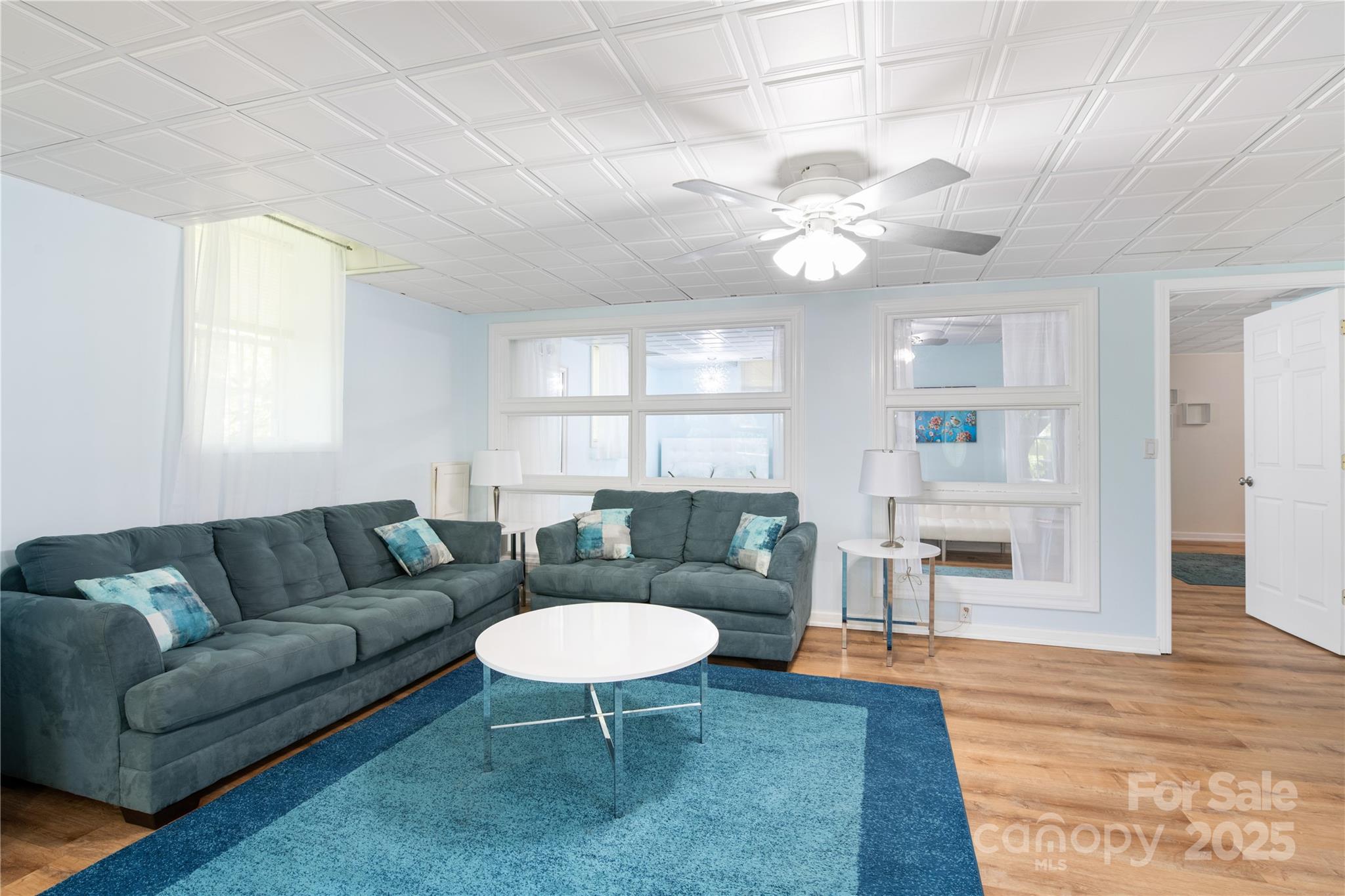 3 Northwood Road Asheville, NC 28804 - Photo 30 of 48 a living room with furniture a dining table and a fireplace