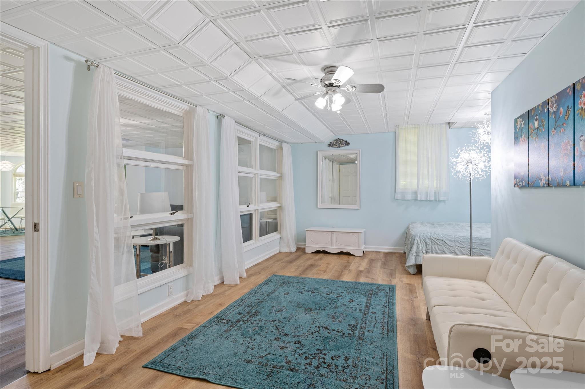3 Northwood Road Asheville, NC 28804 - Photo 34 of 48 a living room with furniture and a chandelier