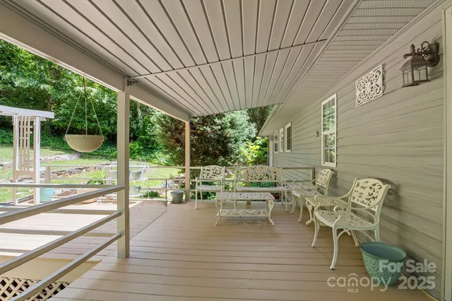 a view of a chairs and table in the patio