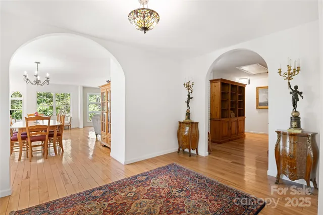 a view of an entryway with wooden floor