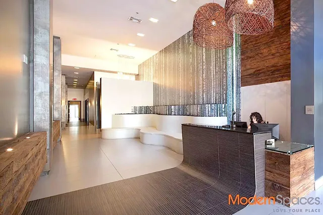 a view of a living room and kitchen with a large window