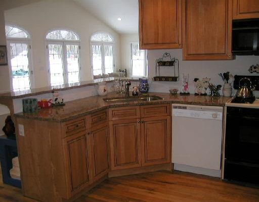 a kitchen with sink cabinets and window