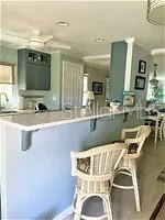 a bathroom with a sink mirror and vanity