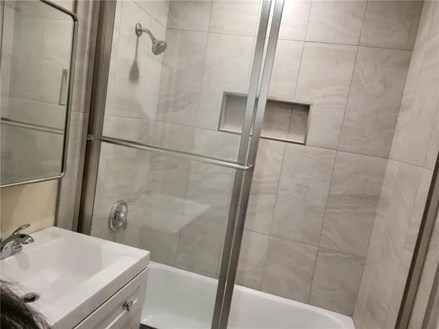 a bathroom with a sink and a shower