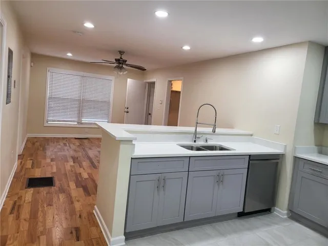 a kitchen with a sink and cabinets