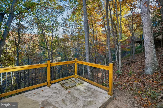 a view of a small yard with wooden fence