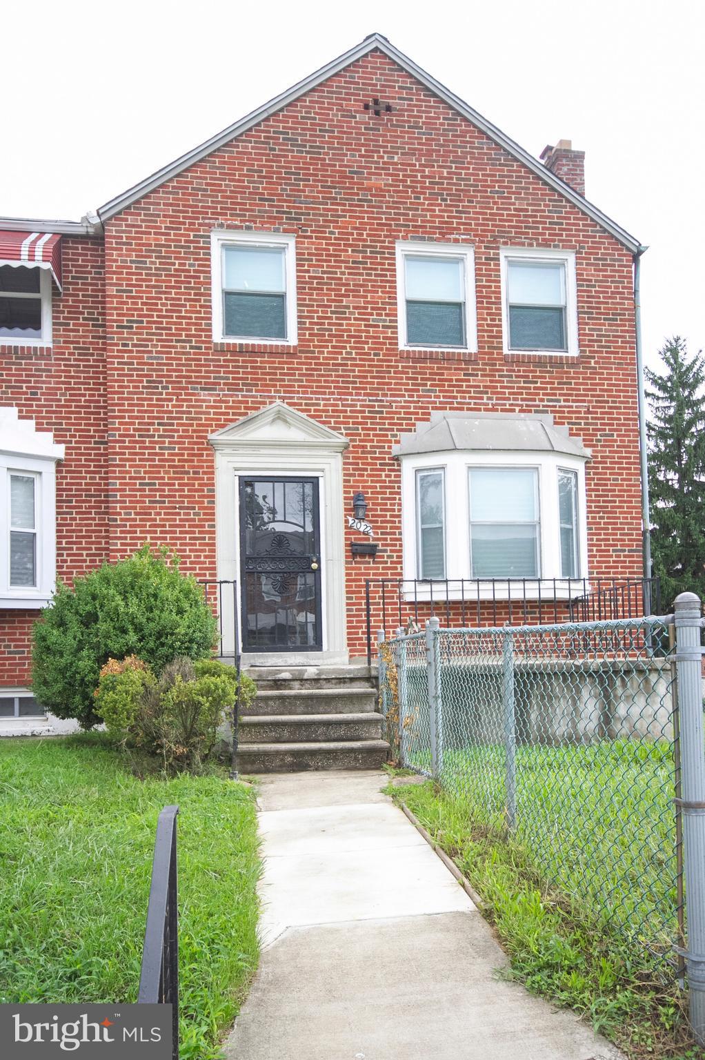 2022 Crestview Road Baltimore, MD 21239 - Photo 1 of 14 a front view of a house with a yard