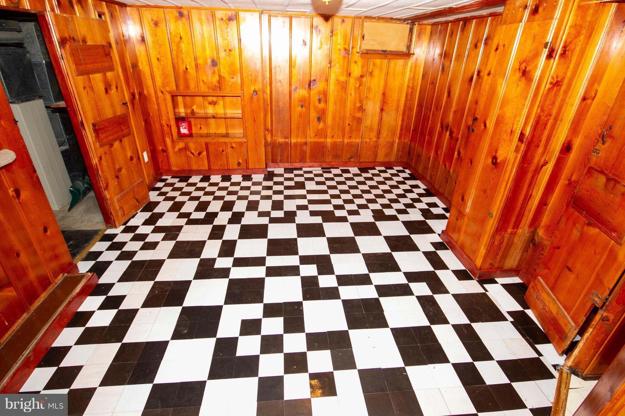 2022 Crestview Road Baltimore, MD 21239 - Photo 13 of 14 a black and white checkered floor with a black white checkered checkered floor