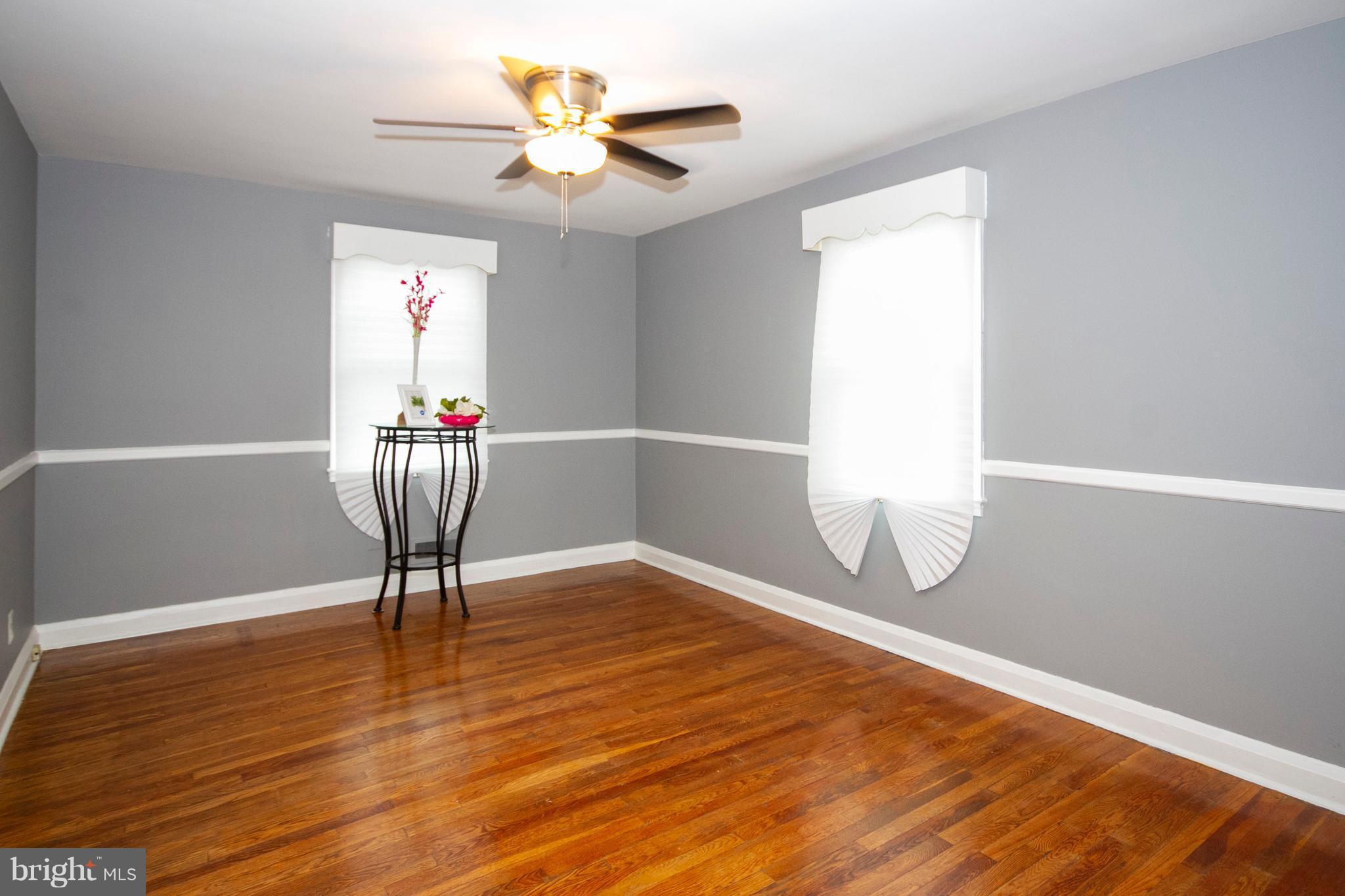 2022 Crestview Road Baltimore, MD 21239 - Photo 5 of 14 a view of an empty room with a window and wooden floor