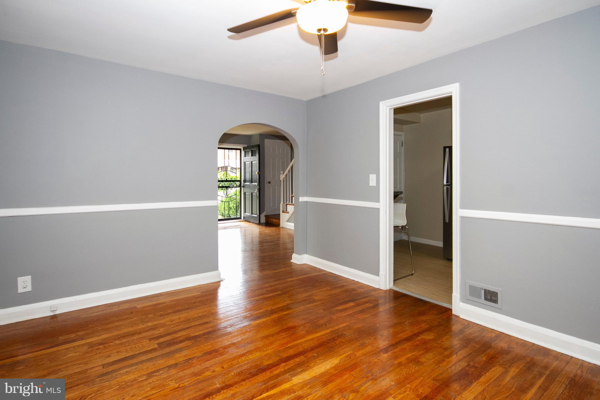 2022 Crestview Road Baltimore, MD 21239 - Photo 7 of 14 wooden floor in an empty room with a window