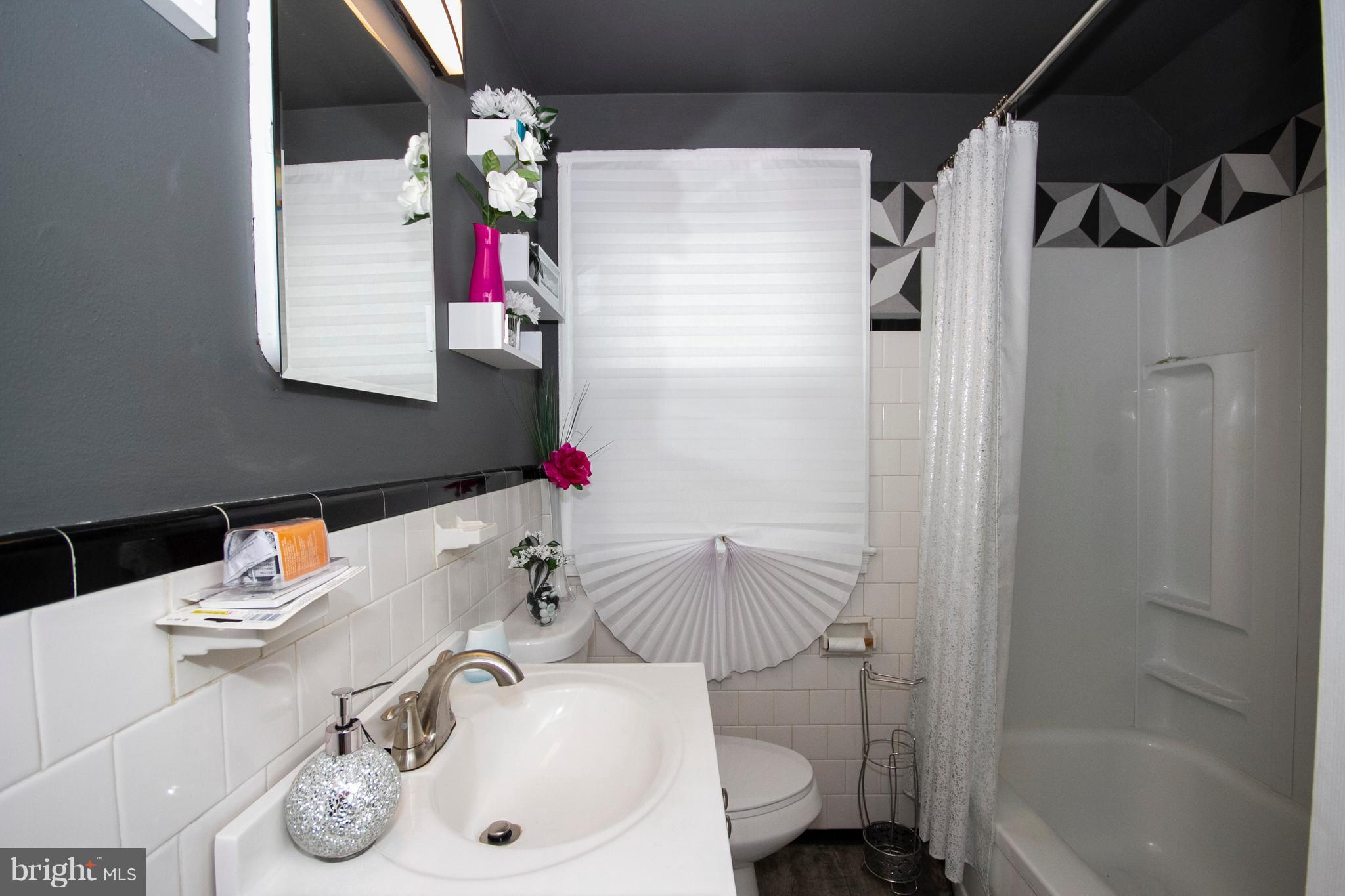 2022 Crestview Road Baltimore, MD 21239 - Photo 8 of 14 a bathroom with a sink toilet and shower